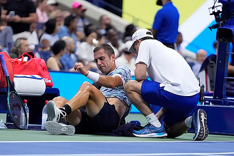 US Open 2024: Laslo Djere, of Serbia, is examined during a second round match against Novak Djokovic